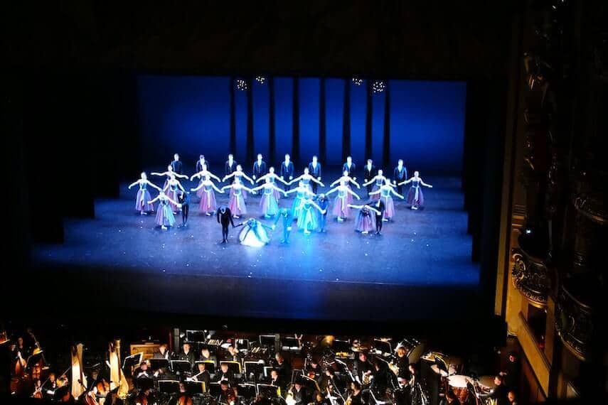 Ballet cast taking a bow on stage at the end of a performance
