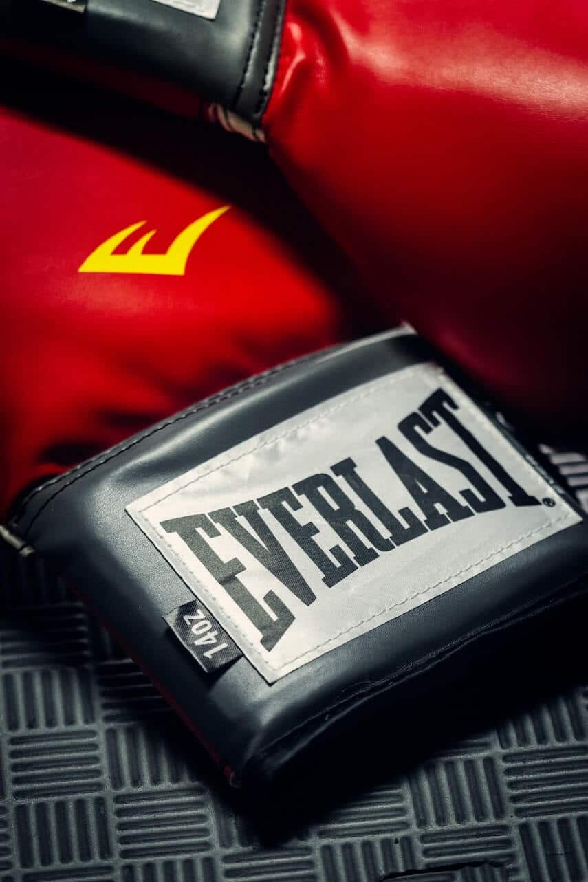 Close up of red boxing gloves with 'Everlast' Branding on the cuff
