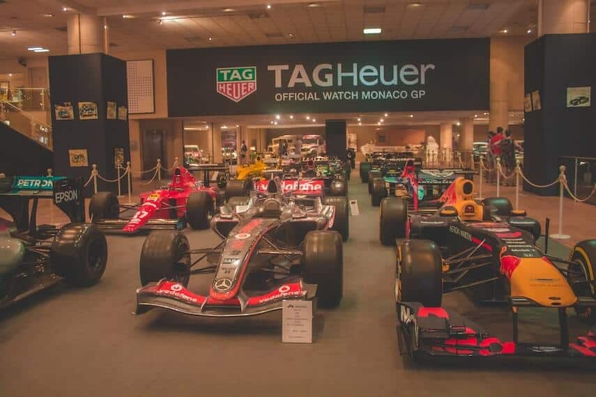 F1 cars from all constructors on distplay in lines under a Tag Heuer Watch sponsorship banner