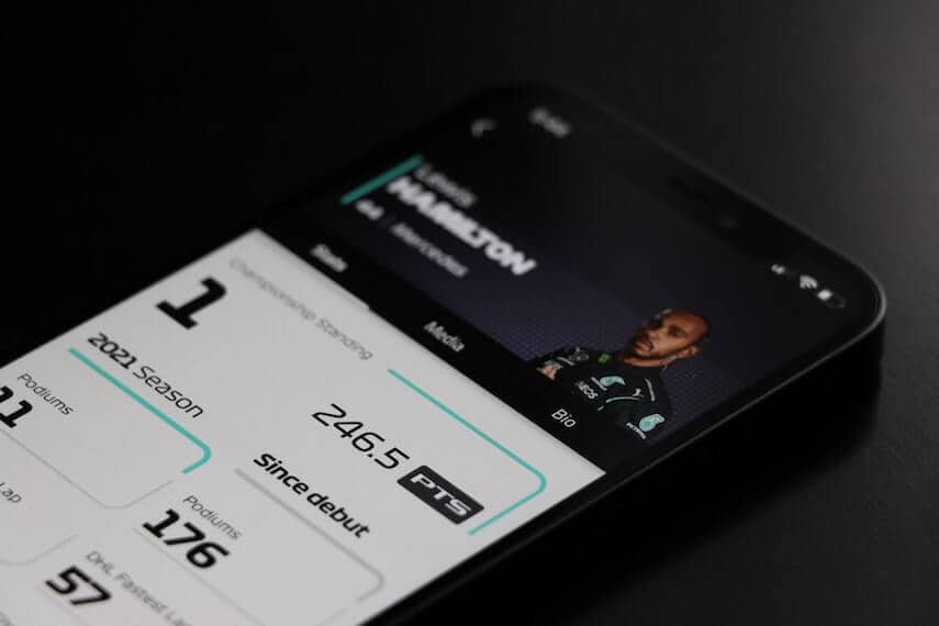 Formula One App open on a smartphone with Lewis Hamilton's profile on display