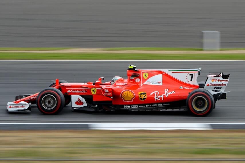 Red Ferarri F1 car on the track