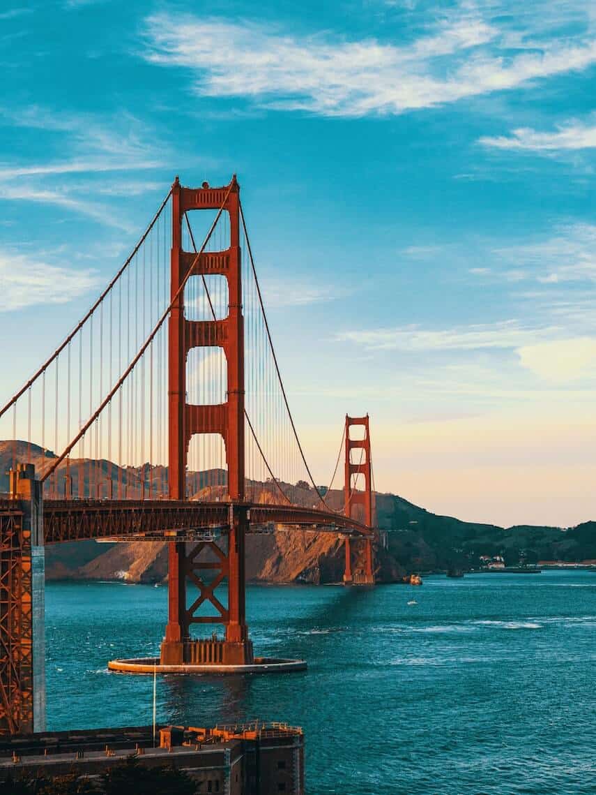 The Red Iron Bridge known as the Golden Gate Bridge above blue water