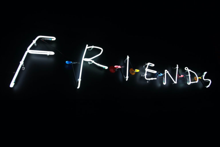 Ultimate Friends Quiz cover photo of an illuminated Neon FRIENDS Sign