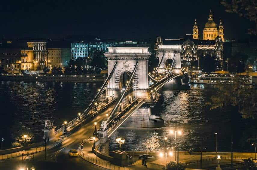 Gothic bridge in Budapest lit up at night