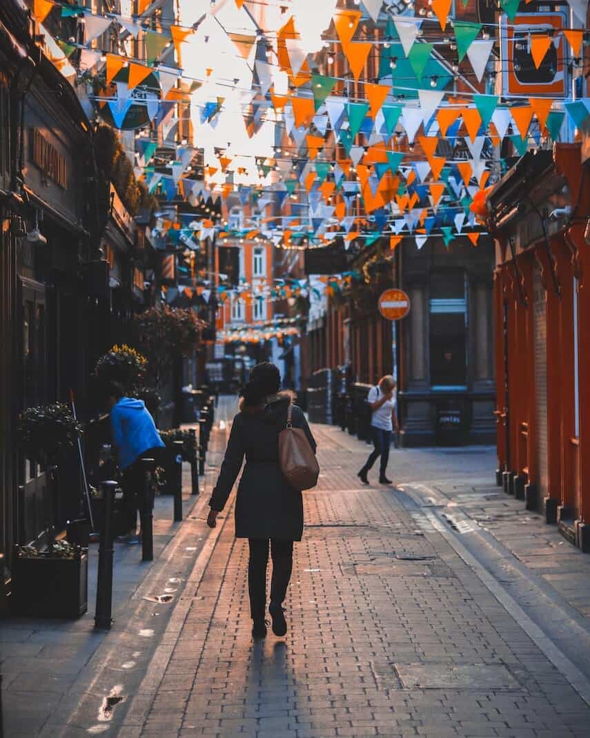 Orange, White and Green bunting across a cobbled street in Ireland