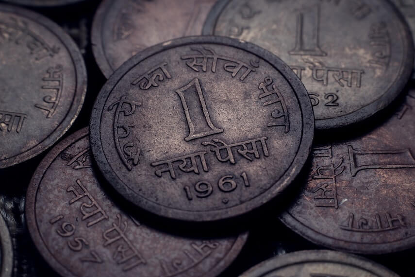 Coins with arabic writing and the date 1961