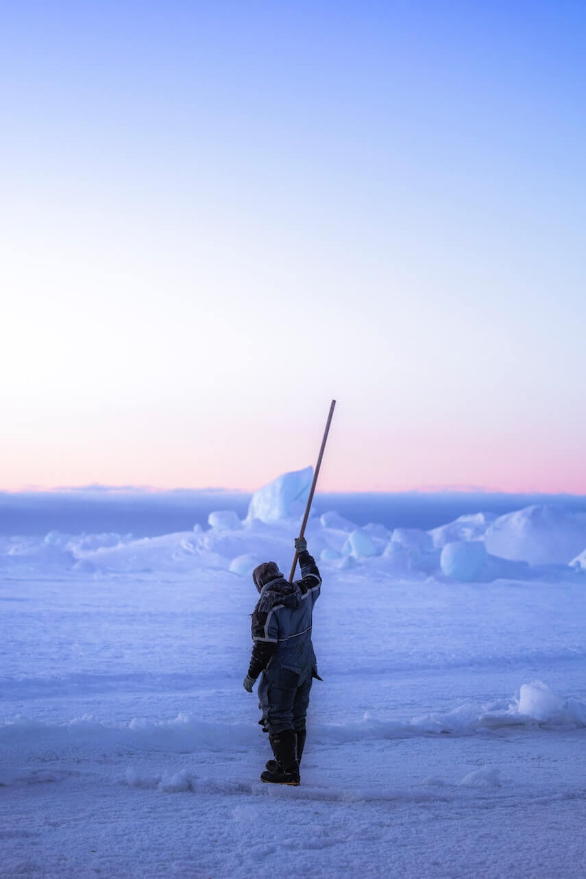 Inuit Man ice fishing