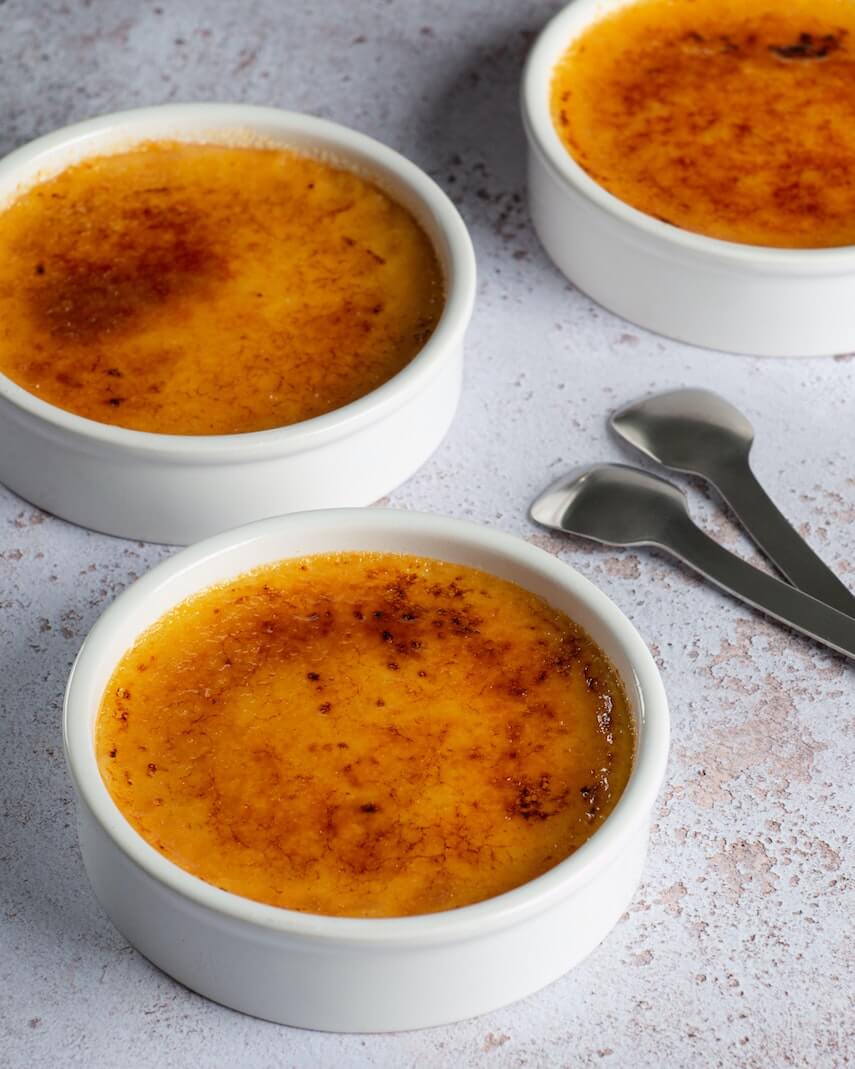 Three individual round creme brule portions