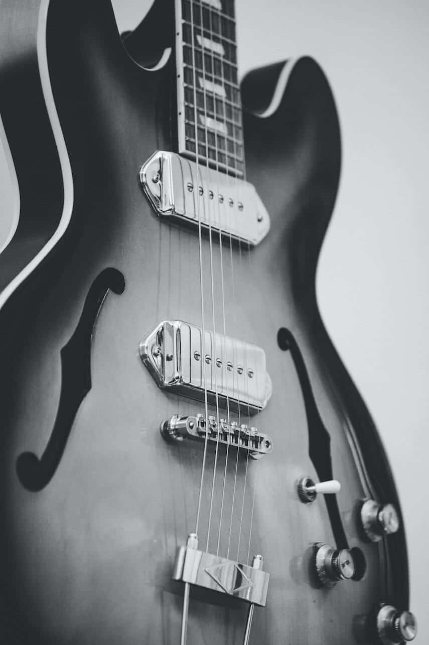 Blank and white photo of the body of an electric guitar