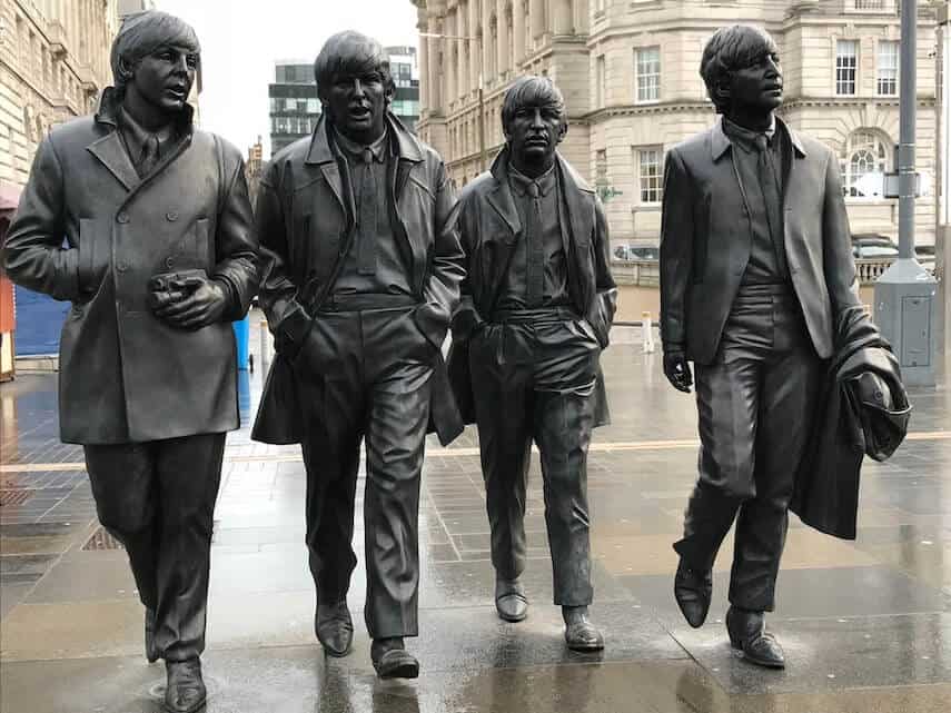 Lifesize iron statues of the 4 Beatles walking towards the camera