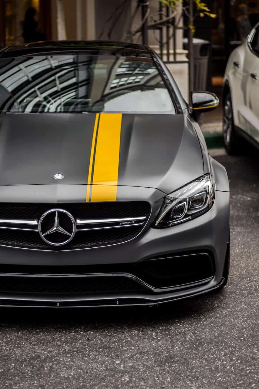 Matt black Mercedes with yellow stripe down the hood