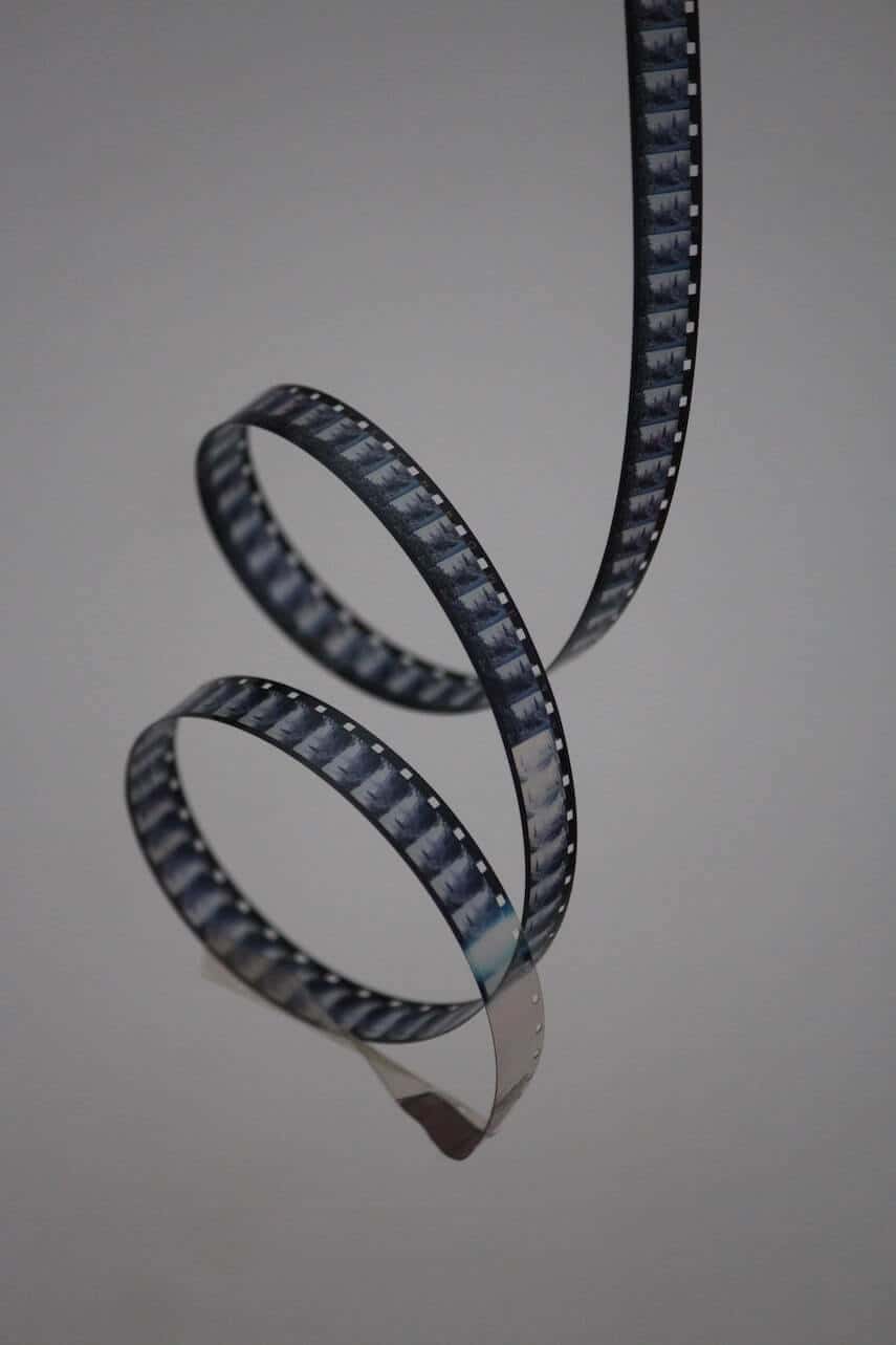 Strip of movie film curling towards the ground