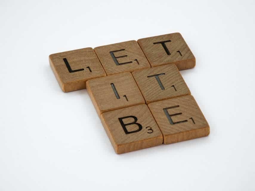 Wooden scrabble letters spelling out 'Let It Be'