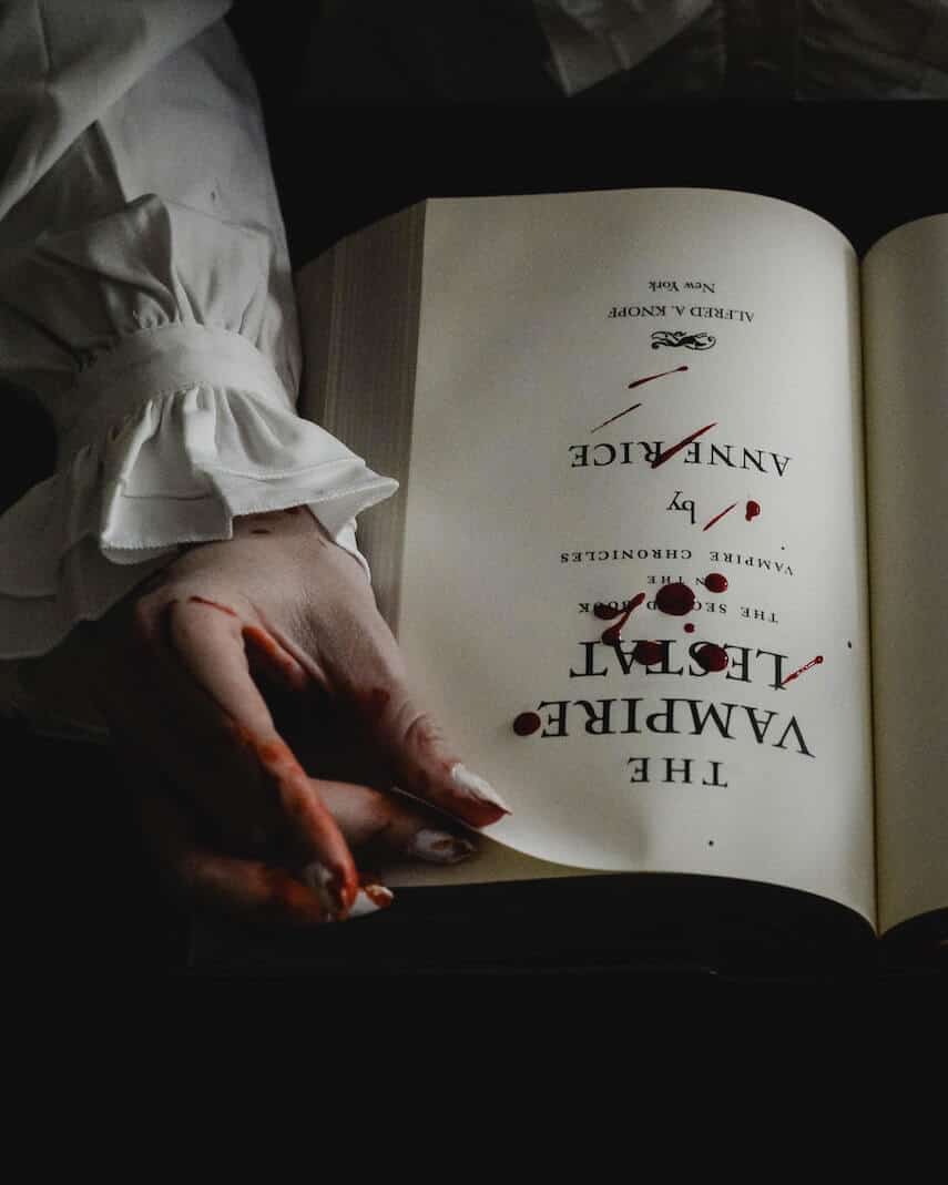 The Vampire Lestat book by Anne Rice, open to the title page covered in drops of blood.